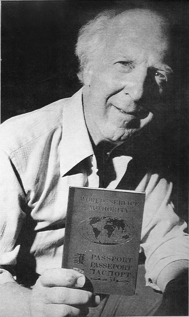 In this Sept. 13, 1988 file photo, Garry Davis, who renounced his U.S. citizenship in 1948 and for the next six decades led a movement for global citizenship, holds a passports issued by the World Service Authority, a non-profit group he founded in 1954 to help promote his goal of a world with no borders.The World Service Authority confirmed Davis died Wednesday, July 24, 2013 in Williston, Vt., at the age of 91. (AP Photo, File)