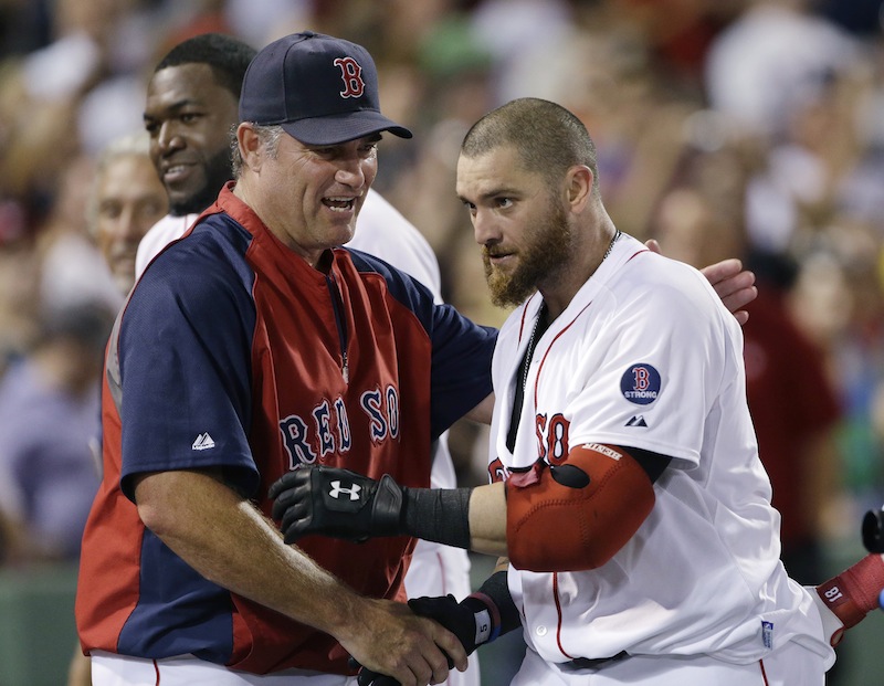 Boston Red Sox's Jonny Gomes, right, is congratulated by manager John Farrell after his pinch-hit walk-off solo home run in the ninth inning of an interleague baseball game against the San Diego Padres at Fenway Park in Boston, Wednesday, July 3, 2013. Boston won 2-1. (AP Photo/Elise Amendola)