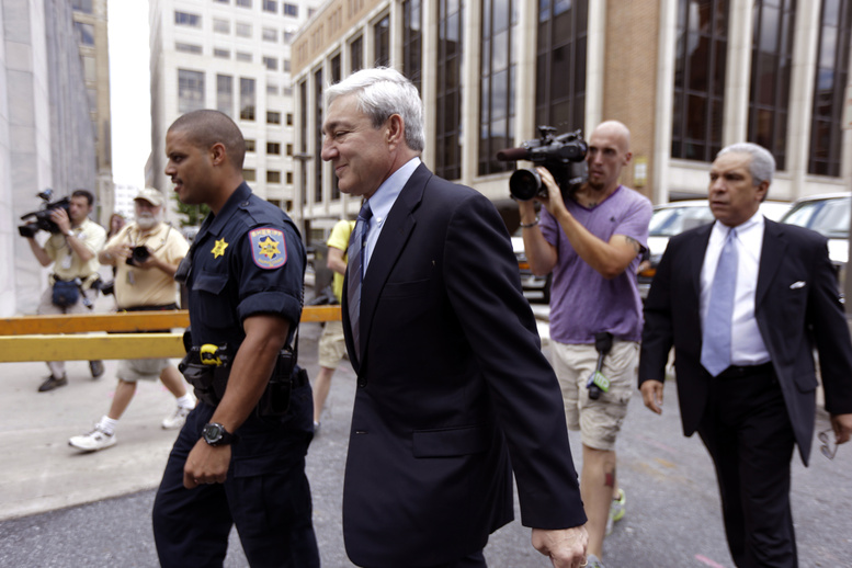 Former Penn State president Graham Spanier walks to the Dauphin County Courthouse on Monday in Harrisburg, Pa. Spanier faces charges in the child sex abuse scandal involving former assistant football coach Jerry Sandusky.
