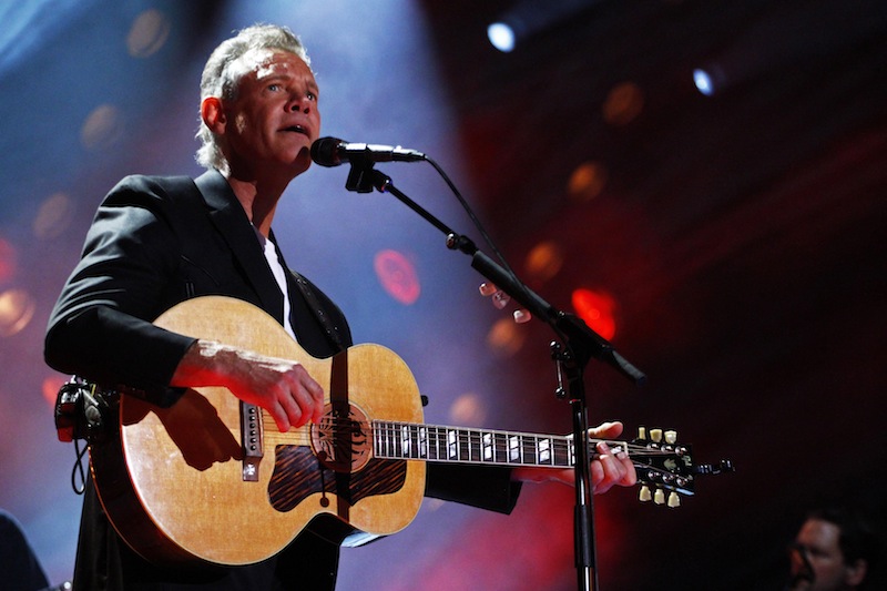 In this June 7, 2013 file photo, Randy Travis performs on day 2 of the 2013 CMA Music festival at the LP Field in Nashville, Tenn. Travis has been hospitalized in Texas with viral cardiomyopathy. A news release from the singer's publicist says Travis was admitted to the hospital Sunday, July 7, 2013, in Dallas. (Photo by Wade Payne/Invision/AP, File)