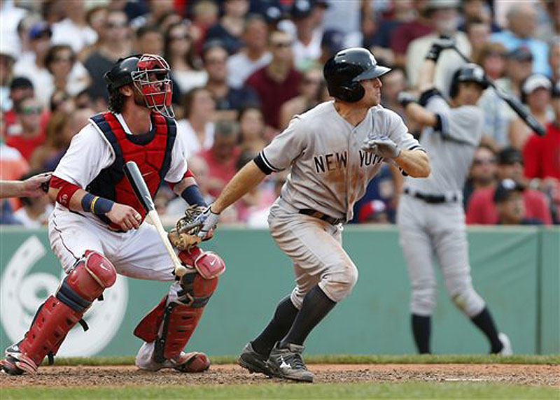 Yankee Brett Gardner watches his single in front of Red Sox catcher Jarrod Saltalamacchia in the seventh inning at Fenwy Park in Boston on Saturday.