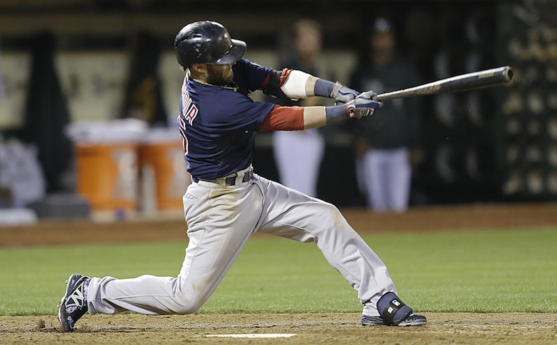 Boston Red Sox's Dustin Pedroia swings for a two run single off Oakland Athletics' Ryan Cook in the eighth inning of a baseball game Friday, July 12, 2013, in Oakland, Calif. (AP Photo/Ben Margot)
