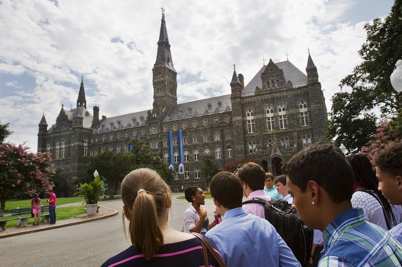 Prospective students tour Georgetown University's campus in Washington, Wednesday, July 10, 2013. The defeat of a student loan bill in the Senate on Wednesday clears the way for fresh negotiations to restore lower rates, but lawmakers are racing the clock before millions of students return to campus next month to find borrowing terms twice as high as when school let out. (AP Photo/Jacquelyn Martin)