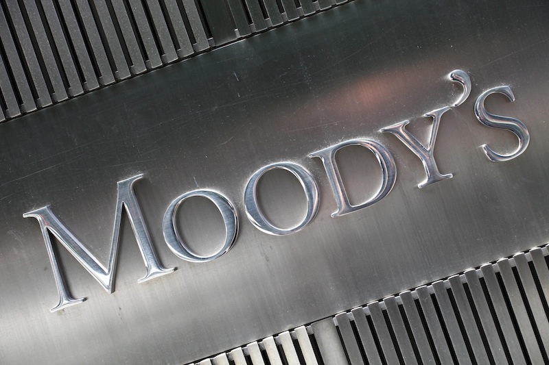 This Aug. 13, 2010 photo shows a sign for Moody's Corp. in New York. Moody's Investors Service upgraded the outlook for U.S. government debt to "stable" from "negative" and affirmed the United States' blue chip Aaa rating on Thursday, July 18, 2013. The rating agency cited a surprising drop in the federal deficit - the difference between what the government collects in taxes and what it spends. The U.S. government is on track to report its lowest annual deficit in five years. (AP Photo/Mark Lennihan)