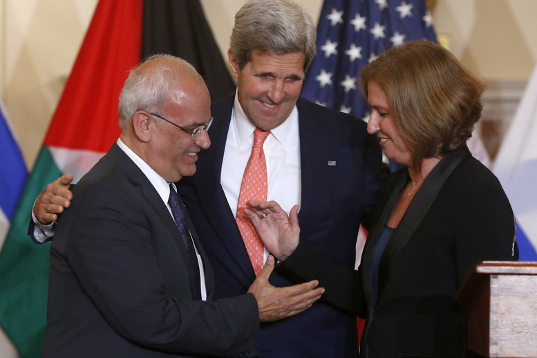Secretary of State John Kerry stands between Israel's Justice Minister and chief negotiator Tzipi Livni, right, and Palestinian chief negotiator Saeb Erekat, as they shake hands after the resumption of Israeli-Palestinian peace talks on Tuesday at the State Department in Washington.
