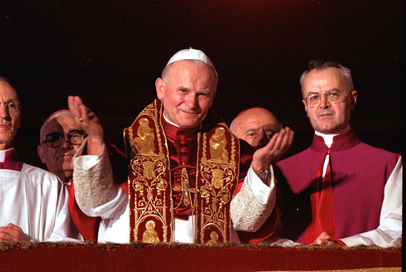 In this Oct. 22, 1978 file photo Pope John Paul II blesses the faithful in St. Peter's Square from a Vatican City balcony right after he was named Pontiff. A Vatican official says Pope John Paul II has cleared the final obstacle before being made a saint. A commission of cardinals and bishops reportedly met Tuesday, July 2, 2013 to consider the case and signed off on it, leaving only Pope Francis to approve it. A Vatican official confirmed that the decision had been taken some time back and that Tuesday's meeting was essentially a formality.