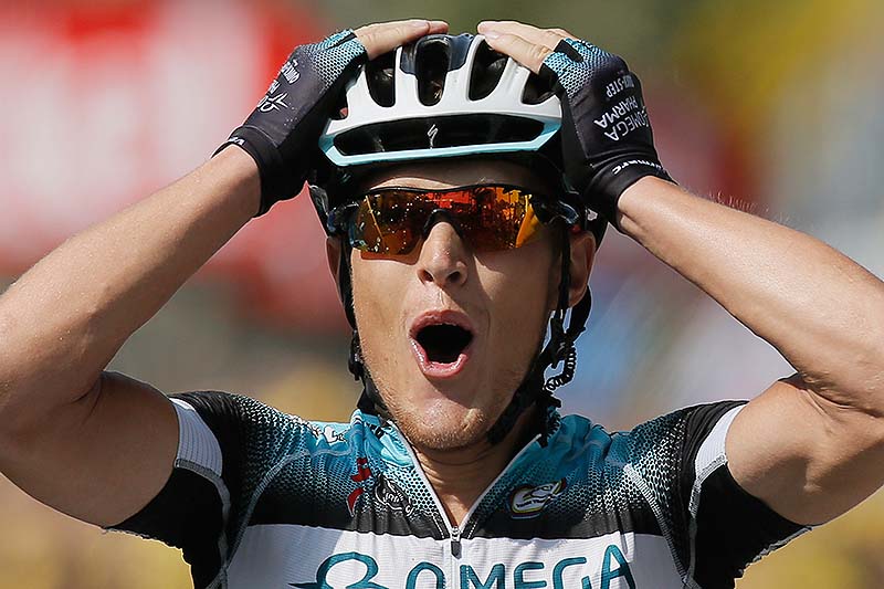 Matteo Trentin of Italy celebrates as he crosses the finish line to win the 14th stage of the Tour de France on Saturday.