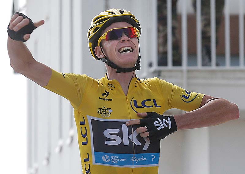 Overall leader Christopher Froome celebrates as he crosses the finish line of the 15th stage of the Tour de France on Sunday.