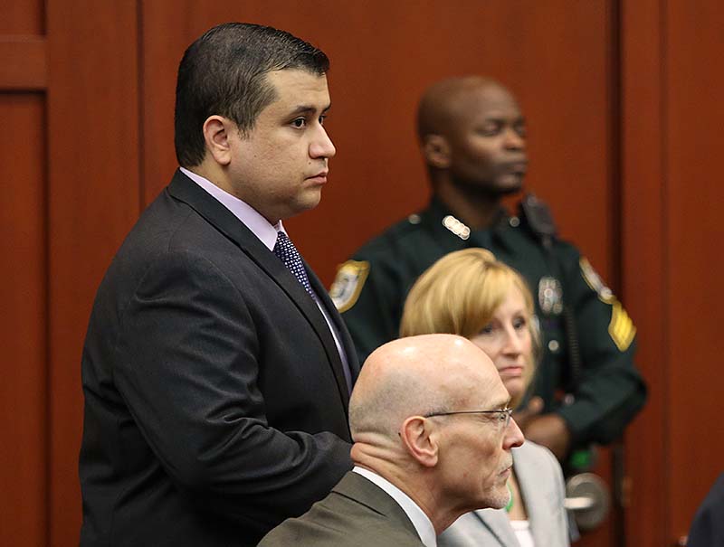 George Zimmerman stands with his defense attorneys during the continuation of jury deliberation in his trial in Seminole circuit court in Sanford, Fla. on Saturday. Zimmerman has been charged with second-degree murder for the 2012 shooting death of Trayvon Martin.