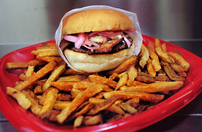 The Red, White and Bleu Burger, the creation of Ben Berman and Jack Barber, owners of the Mainely Burgers food truck, is topped with pickled red onions, bleu cheese and thick-cut bacon.