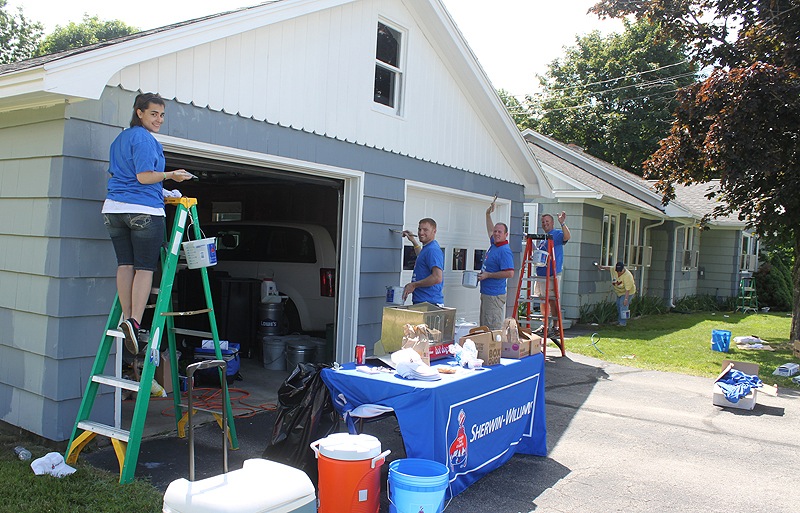 The first day of summer was a perfect day for painting, and Waban’s group home on Riverview Street in Sanford was the lucky beneficiary of the Sherwin-Williams National Painting Week donation of supplies, labor and expertise. Volunteer employees from Sherwin-Williams included, from left, Tiffany Poirier from the Yarmouth store; Jason Johnson from the Biddeford store; district manager Tom Pitts; regional manager Bob Decolfmacker; and Springvale store manager Aimee Mattingly painting the Waban group home on Riverview Street.
