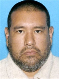 Dr. Anthony Garcia, 40, is pictured in this photo released by the Omaha police. Garcia has been linked to both the May 2013 Omaha slayings of 65-year-old Roger Brumback and 65-year-old Mary Brumback and the 2008 stabbing deaths of an 11-year-old Thomas Hunter and his family housekeeper, 57-year-old Shirlee Sherman. The slain Brumback and Hunter fired Garcia in 2001 when he was a pathology resident at Creighton Medical School.