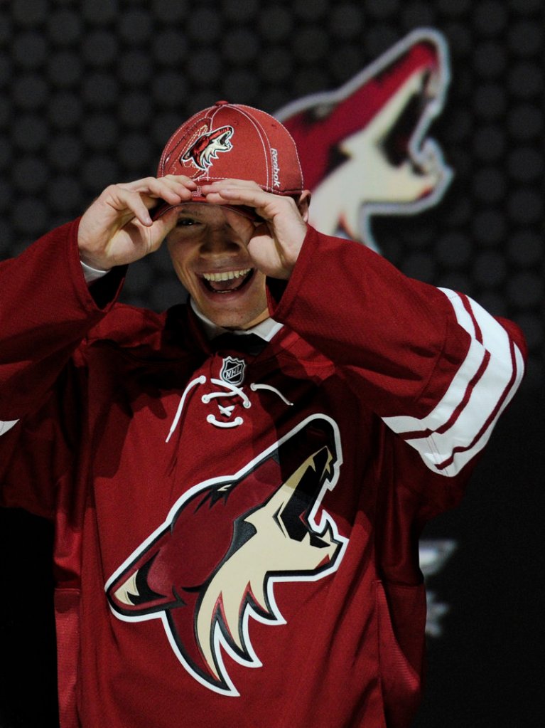 Max Domi, whose father has the third-most penalty minutes in NHL history, is all smiles after being selected in the first round by the Coyotes Sunday.