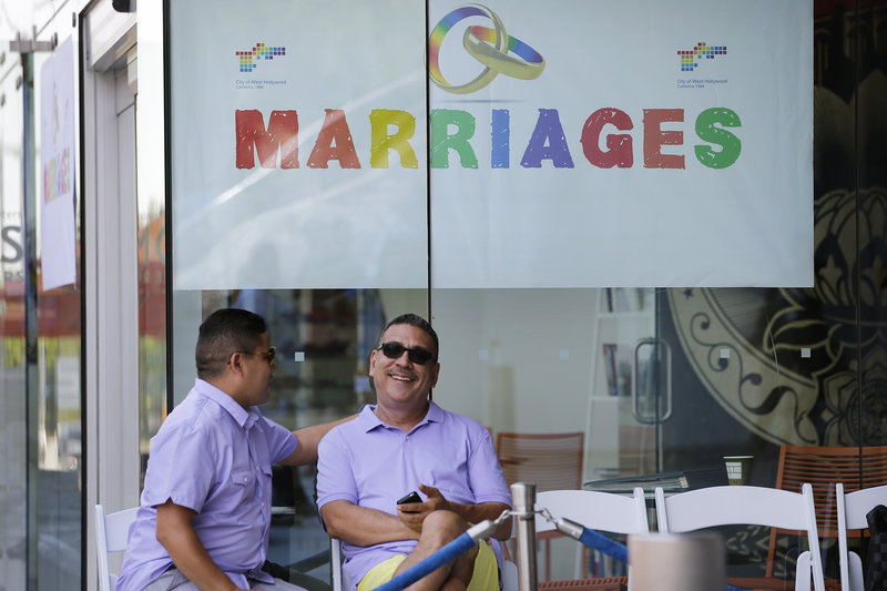 Jose Guerrero, left, and Patrick Rodriguez chat before their wedding ceremony in West Hollywood, Calif., on Monday. The city of West Hollywood was offering civil marriage ceremonies for same-sex couples free of charge Monday.