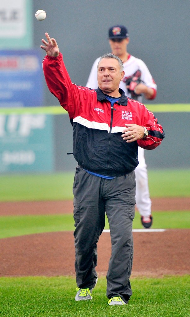 Bernie Carbo, who hit a key home run for the Boston Red Sox in Game 6 of the 1975 World Series, throws out the first pitch at Hadlock.