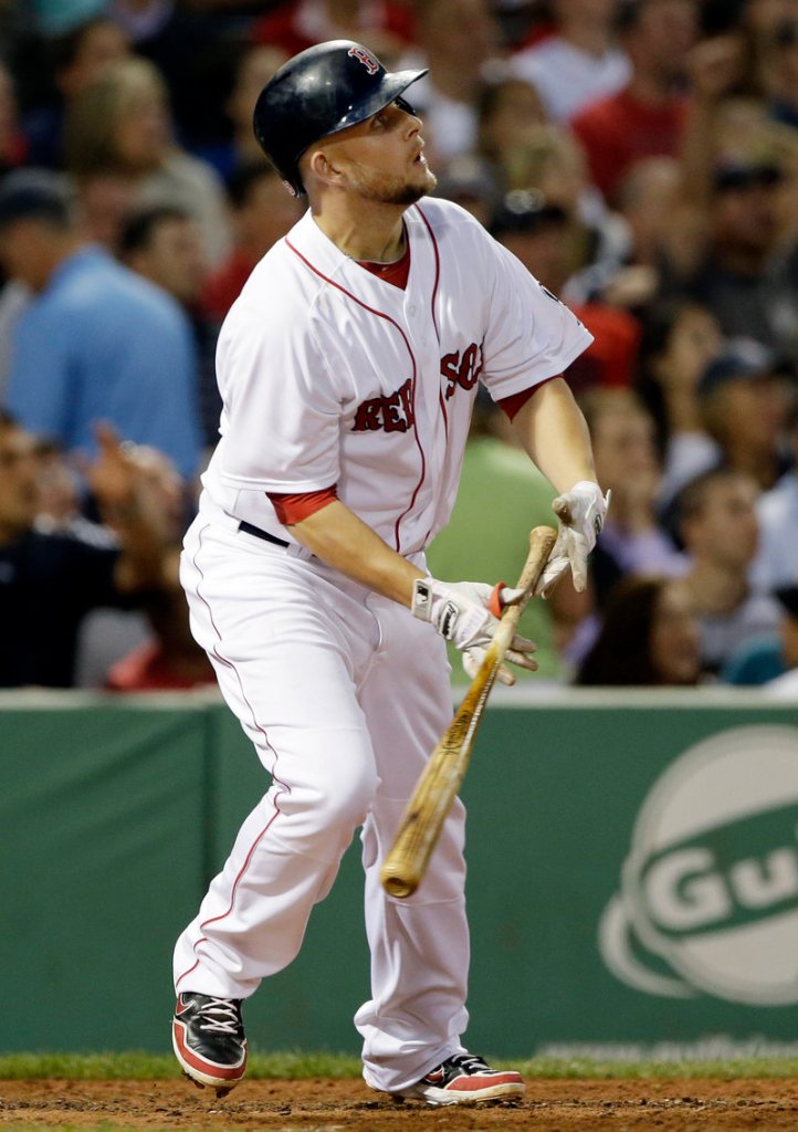 Brandon Snyder watches his three-run double during the fourth inning Tuesday night against the San Diego Padres at Fenway Park.