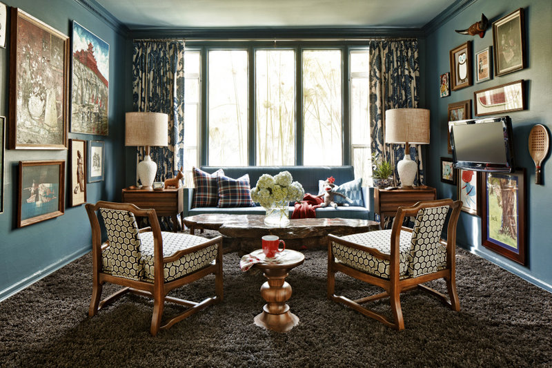 A red, white and blue palette with wood tones and muted browns creates a rich, layered look in this weekend home.