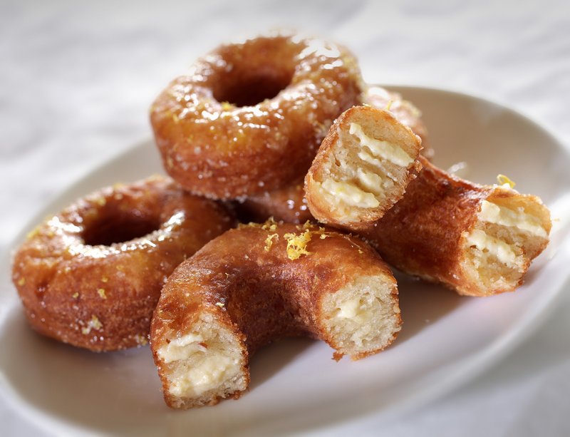 Homemade Cronut-like pastries are a mashup of croissants and doughnuts, fried and filled with pastry cream.