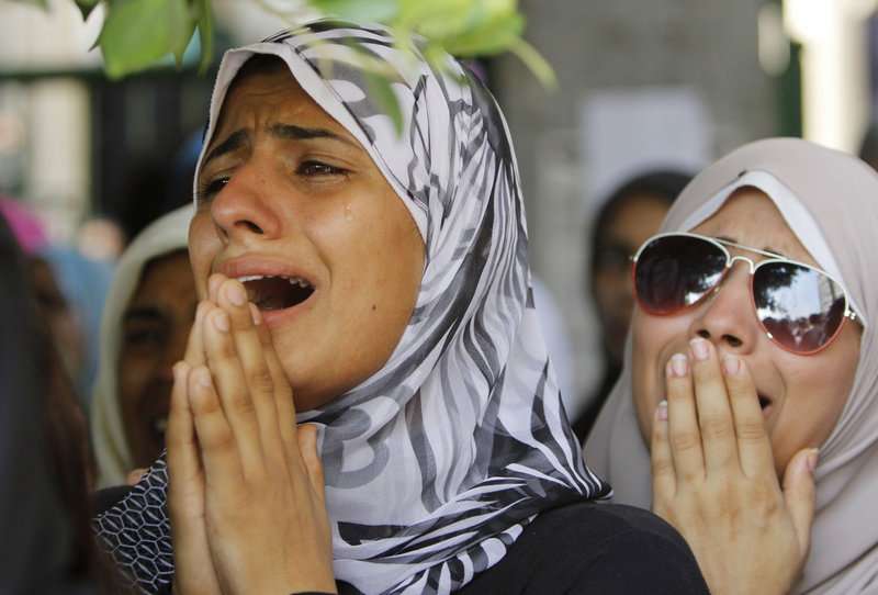 Women grieve during the funeral Saturday of opponents of Egypt’s ousted president Mohammed Morsi. They were killed during clashes with Morsi supporters in Cairo.