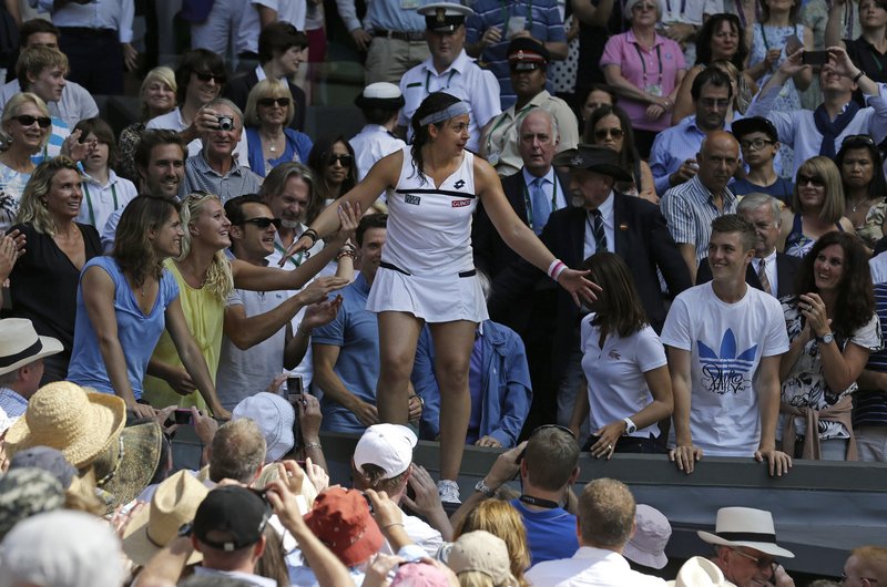 Marion Bartoli of France was in a place she dreamed she’d be someday, among the crowd, exuberant as the Wimbledon women’s champion. She never lost a set in the two-week event, and dispatched Sabine Lisicki of Germany in an error-strewn final, 6-1, 6-4.
