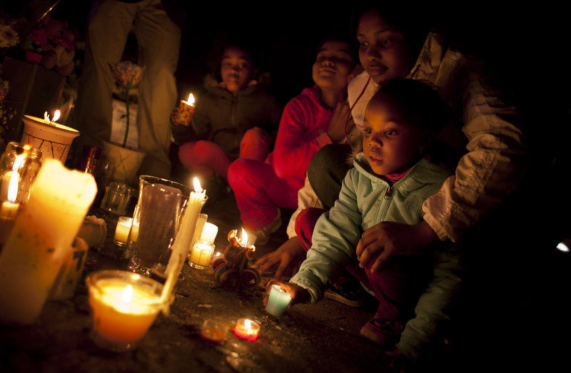 Children light candles for Nelson Mandela on Sunday at the Mediclinic Heart Hospital where the former South African president is being treated in Pretoria, South Africa.