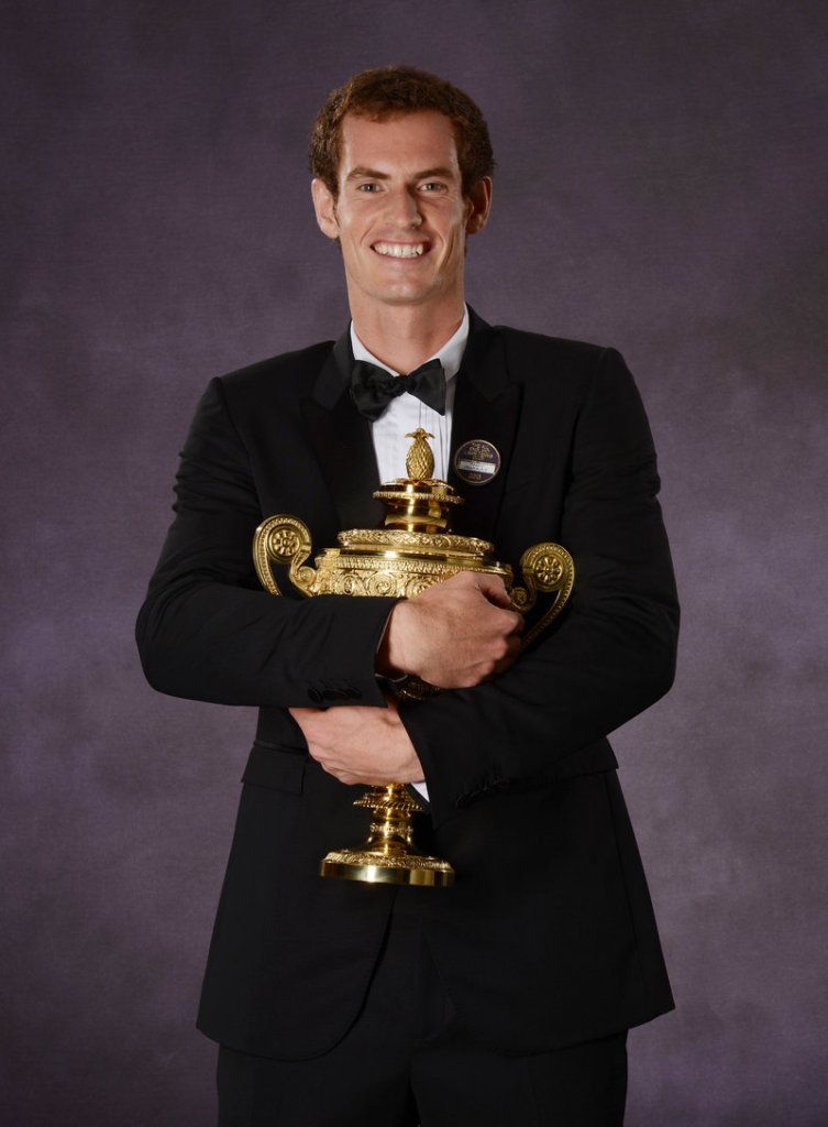 Andy Murray holds the Wimbledon trophy – the first Briton to do since Fred Perry a long, long 77 years ago.