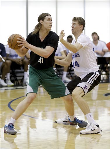 Kelly Olynyk fronts up with Detroit’s Travis Peterson in an NBA summer league game at Orlando, Fla., on Monday. The Gonzaga product is earning praise, but tends to be too unselfish at times.