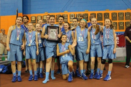 Members of the Yes! sixth-grade girls’ basketball team, from left to right: Kneeling: Meghan Hoffses; Front row: Mandy Mastropasqua, Isabel Dawson, Catherine Reid, Mackenzie Holmes, Mackenzie Emery, Meg Kelly, Julia Martel and Lucy Leen; Back: Coach Eric Dawson, Claire Brady, Coach Lenny Holmes, Coach Bob Emery, Clementine Blaschke and Head Coach Dudley Davis.