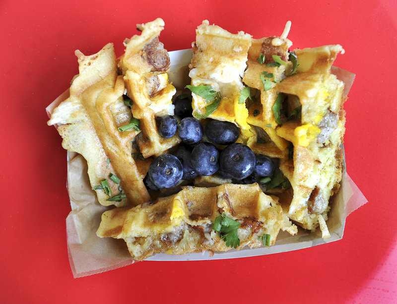 The Kitchen Sink – egg, home fries and choice of meat cooked in a waffle – served at Wannawaf in Portland.