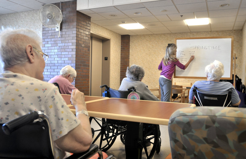Tina Reese leads a word game for nursing home residents in Lancaster, Pa. The U.S. census counted 425,000 Americans age 95 and older in 2010, 26 percent more than in 2000.