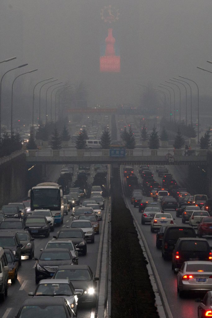 Traffic during a day of heavy pollution in Beijing, China, in January 2014. 