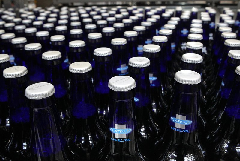 Bottles of Bud Light Platinum move along during the packaging process.