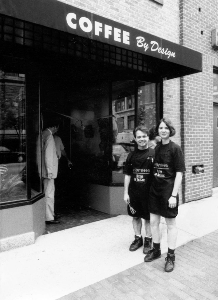 Coffee By Design’s owners pose outside their first coffeehouse on Congress Street on July 1, 1994, the day it opened. Business has been booming ever since.