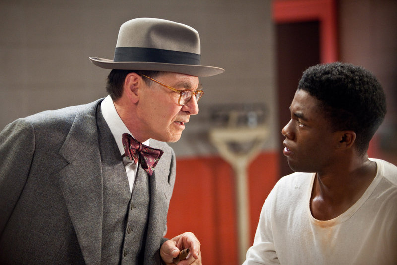 Harrison Ford as Branch Rickey and Chadwick Boseman as Jackie Robinson in “42.”
