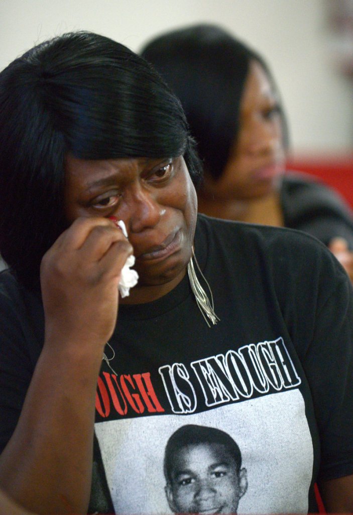 Nichole Mitchell wipes away tears during the sermon at a youth service at the St. Paul Missionary Baptist Church in Sanford, Fla., Sunday. Many in the congregation wore hooded sweat shirts to show support of Trayvon Martin.