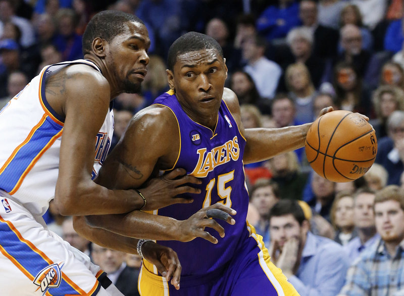 Metta World Peace, shown driving around Oklahoma City’s Kevin Durant last season while playing for the Lakers, expects to sign with the New York Knicks.