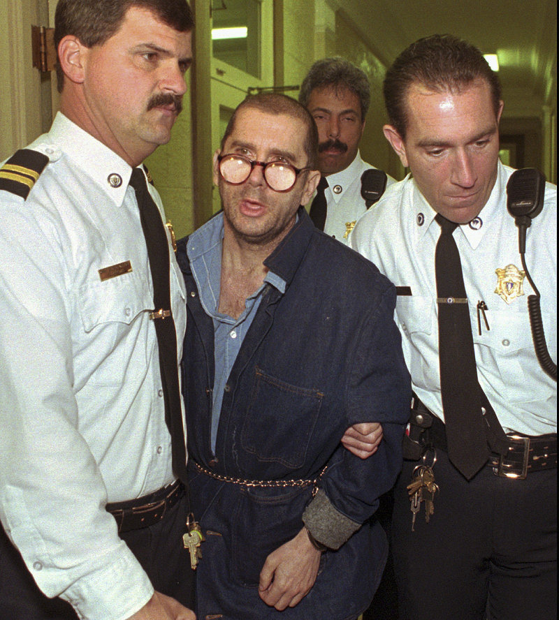 In this April 29, 1996 file photo, Lewis Lent Jr. is led from the Berkshire County Courthouse in Pittsfield, Mass., after a competency hearing was postponed. Massachusetts law enforcement authorities said Monday, July 15, 2013, that Lent, who is serving a life sentence for killing two children, also is responsible for the disappearance and death of James Lusher, 16, who was never seen again after leaving his Westfield, Mass., home on a bicycle ride in 1992. (AP Photo/Alan Solomon)
