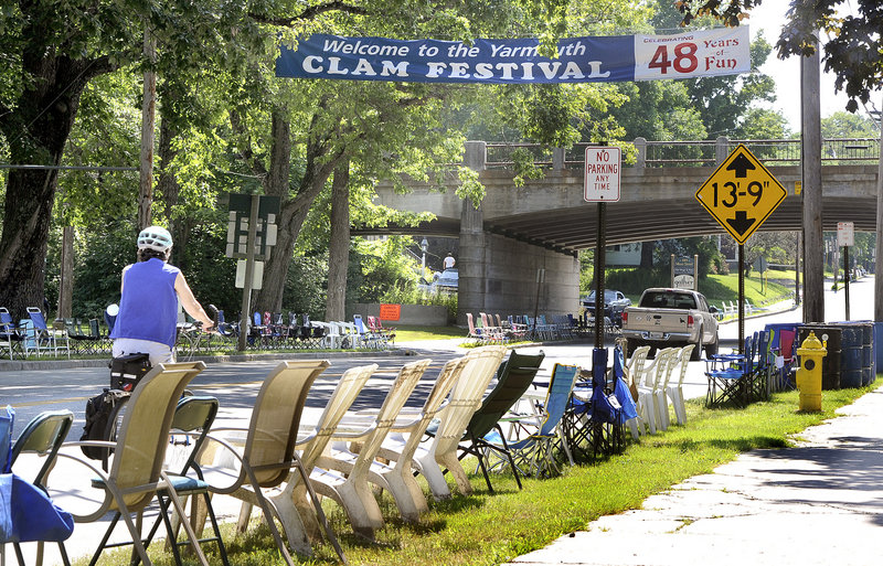 Yarmouth residents line Main Street with chairs for the Yarmouth Clam Festival. Photographed on Tuesday, July 16, 2013.