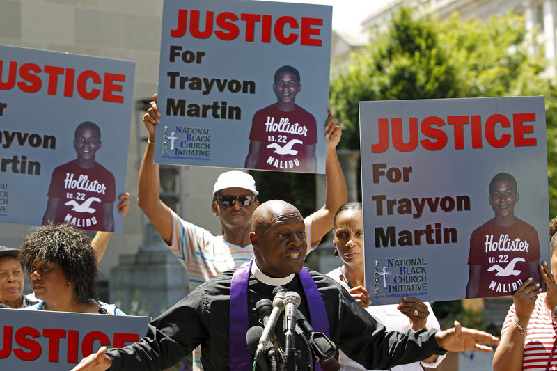 Anthony Evans, president of the National Black Church Initiative, speaks to the media during a demonstration asking for justice for Trayvon Martin, outside the Department of Justice in Washington on Monday. George Zimmerman was acquitted in the shooting death of the unarmed, 17-year-old black teenager.