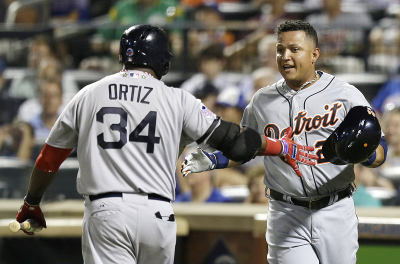 David Ortiz of the Boston Red Sox congratulates Miguel Cabrera of the Detroit Tigers after Cabrera scored on Jose Bautista’s sacrifice fly in the fourth inning of the American League’s 3-0 victory Tuesday.