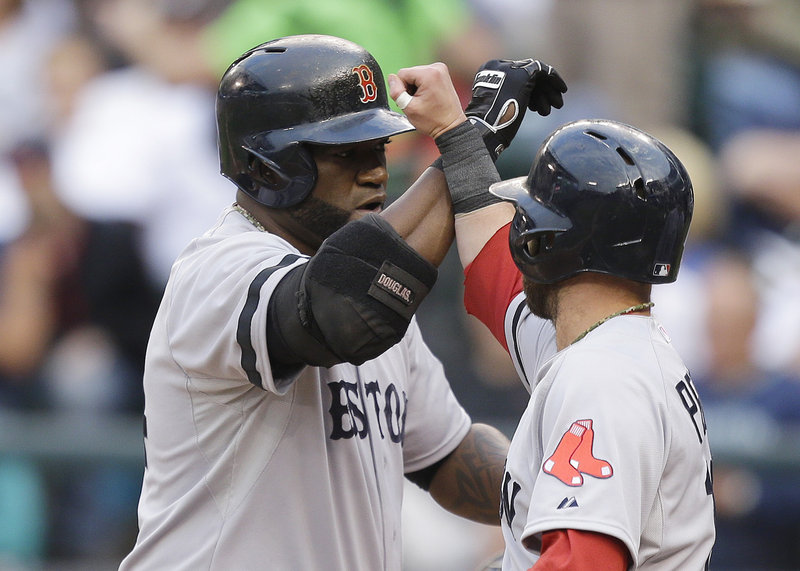 David Ortiz, left, and Dustin Pedroia are two of the hitters who have given Boston a potent offense this year – the Sox are leading the majors in a number of key categories.