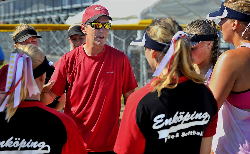Scarborough Coach Tom Griffin shares his knowledge of softball during a break in practice as a team of Swedish players learn the finer points of the game.
