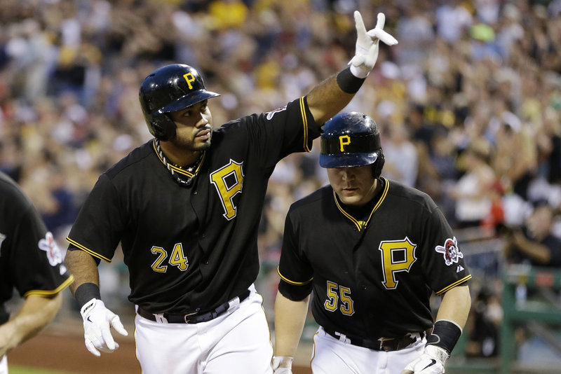 Pedro Alvarez, left, celebrates with teammate Russell Martin as they return to the dugout after another Pittsburgh Pirates victory. The longtime NL Central doormats are finally contending again.
