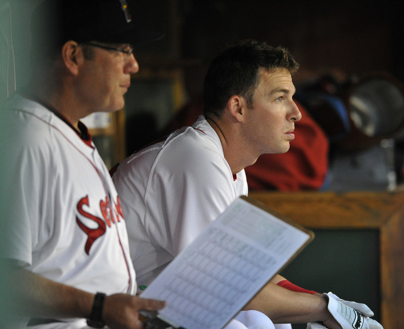 Stephen Drew, the Red Sox shortstop on the mend, sits next to Sea Dogs hitting coach Rich Gedman during Drew’s rehab stint in Portland. Drew hopes to rejoin the Red Sox for Saturday’s game with the Yankees.