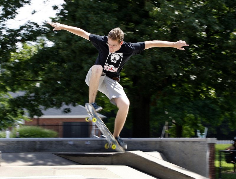 Joshua Roberts catches some air after leading a recent Skate Church service at the Skate Park in Woodland Park in Lexington, Ky. “What better way to do church than with a skateboard?” he said.