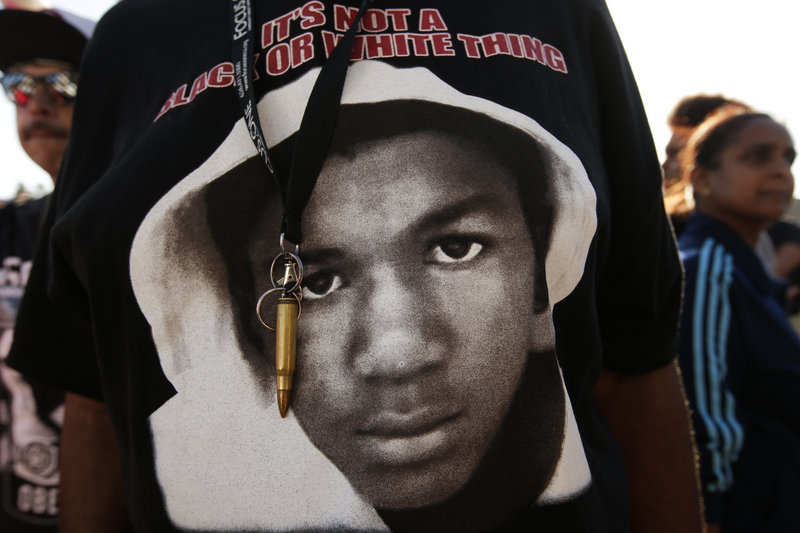 An image of Trayvon Martin and a bullet shell keychain are seen at a protest in Los Angeles on July 15 in response to George Zimmerman’s acquittal in the fatal shooting of the teenager in 2012.