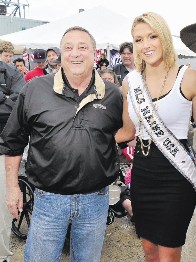Gov. Paul LePage poses with Miss Maine USA Ashley Marble in 2011. He wanted to give her a job promoting education.