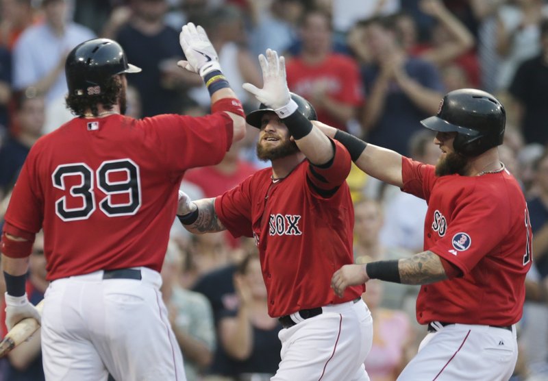 Jonny Gomes, right, is congratulated by Jarrod Saltalamacchia after hitting a two-run homer Friday night for the Boston Red Sox in the second inning of a 4-2 victory against the New York Yankees at Fenway.