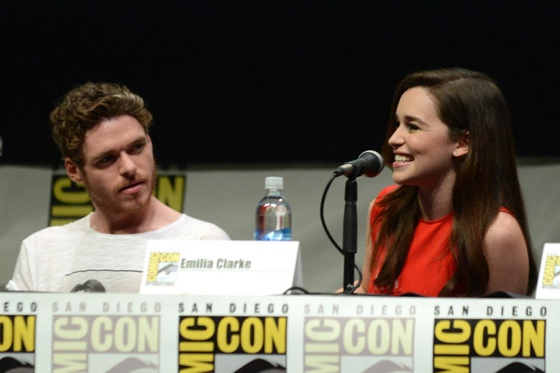 Richard Madden, who plays Robb Stark, and Emilia Clarke, who plays Daenerys Targaryen, appear at Comic-Con on Friday in San Diego.