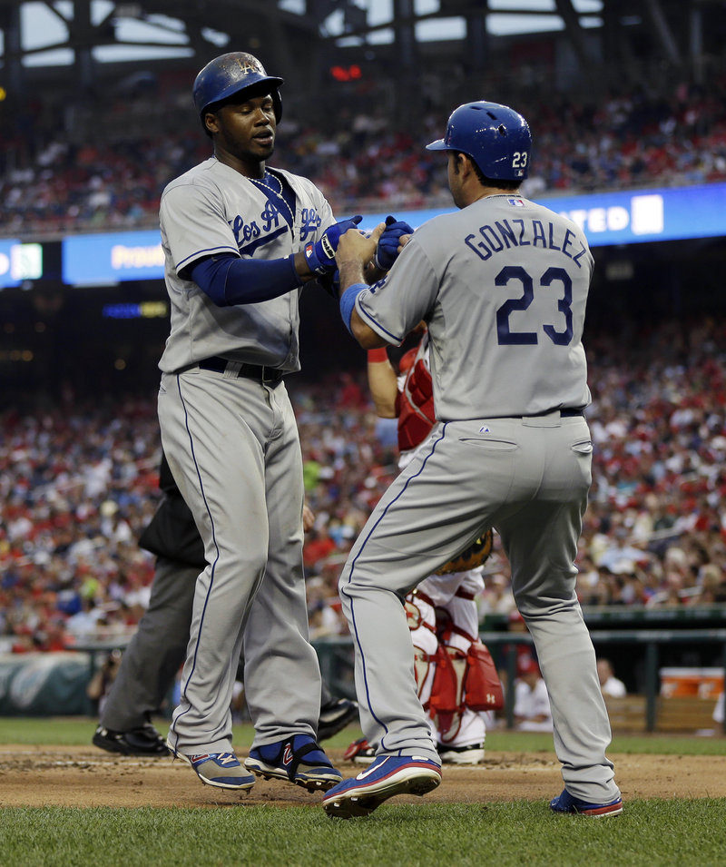 The Dodgers’ Hanley Ramirez, left, is greeted by Adrian Gonzalez after hitting a two-run homer in 3-2 win against the Nationals at Washington on Friday.